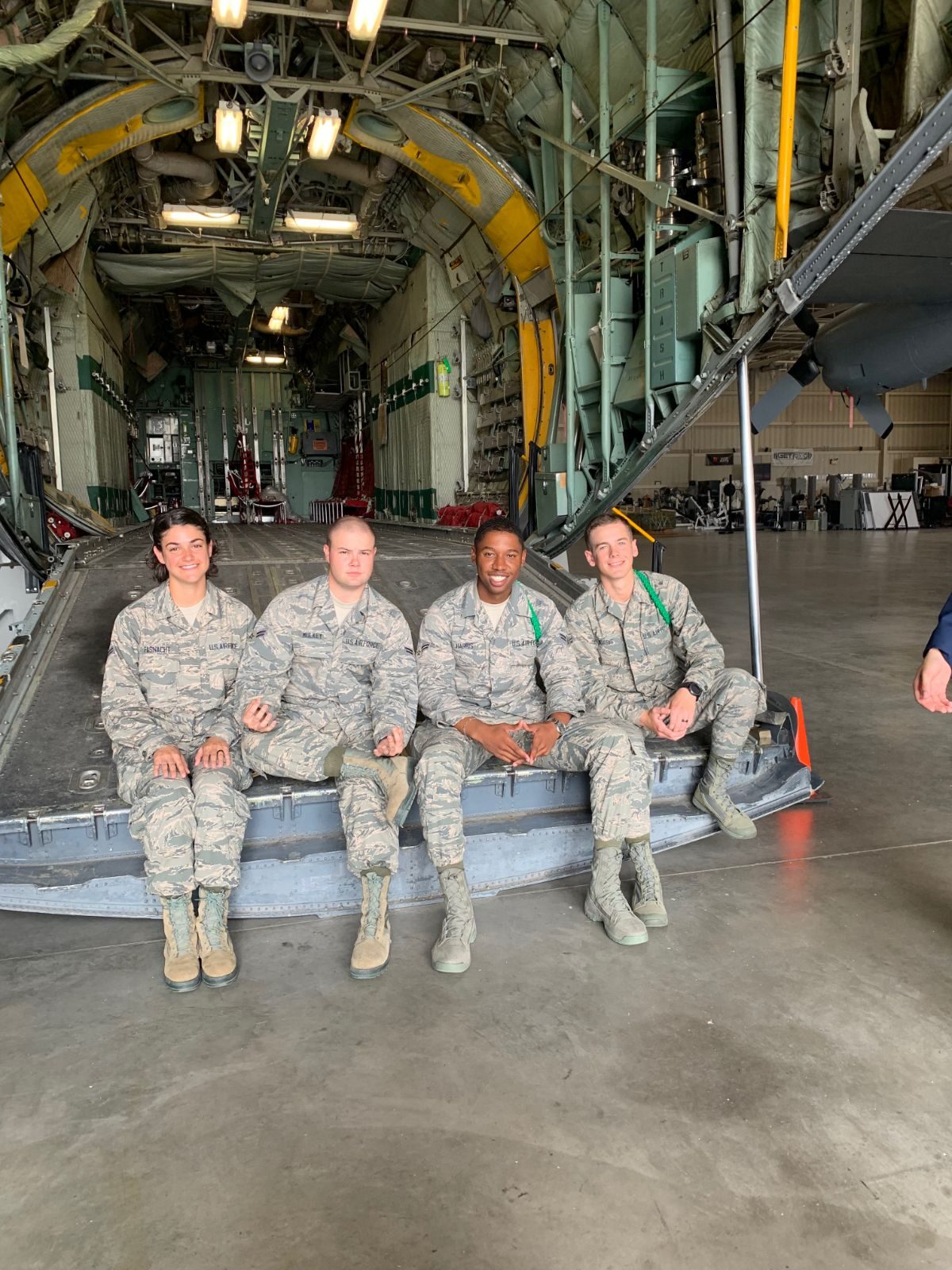 Airmen including John Mulkey on the cargo ramp of a C-130 aircraft